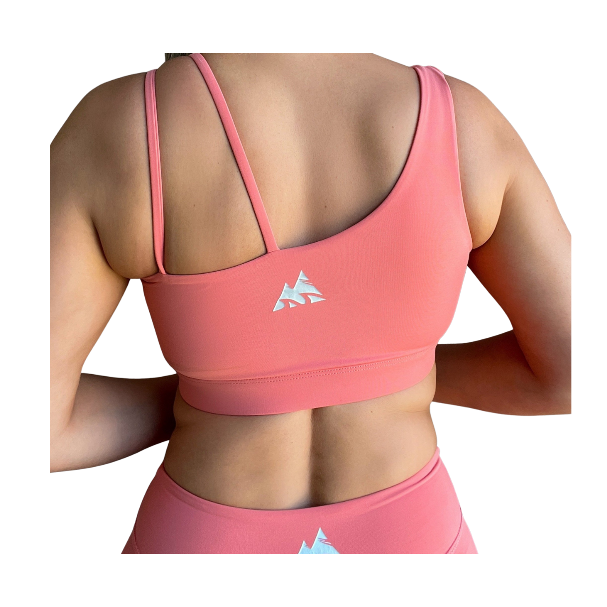 Coral asymmetrical sports bra with one thick strap and two thinner straps