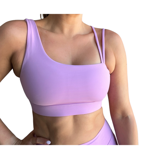 Lavender asymmetrical sports bra with one thick strap and two thinner straps